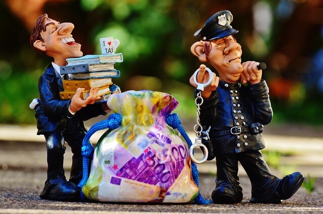 taxes-tax-evasion-police-handcuffs (1)